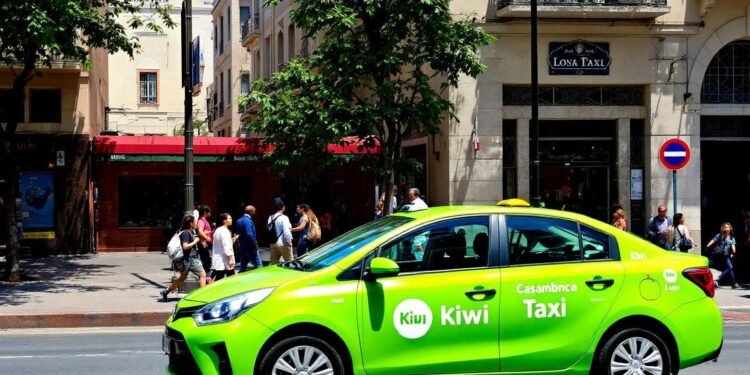 Vibrant lime green taxi parked on city street with pedestrians