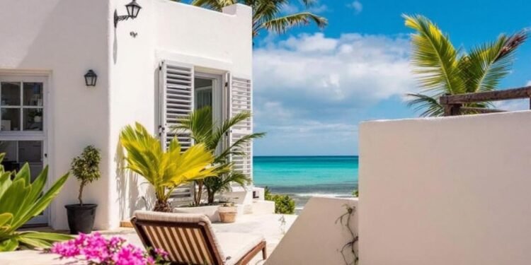 Sunny beach patio with palm trees and ocean view