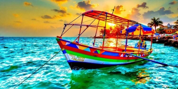 Colorful fishing boat floating on turquoise waters at golden sunset