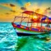 Colorful fishing boat floating on turquoise waters at golden sunset